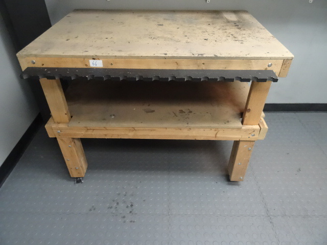 lot 66 image: Wood work bench on wheels. 48 x 32 x 36