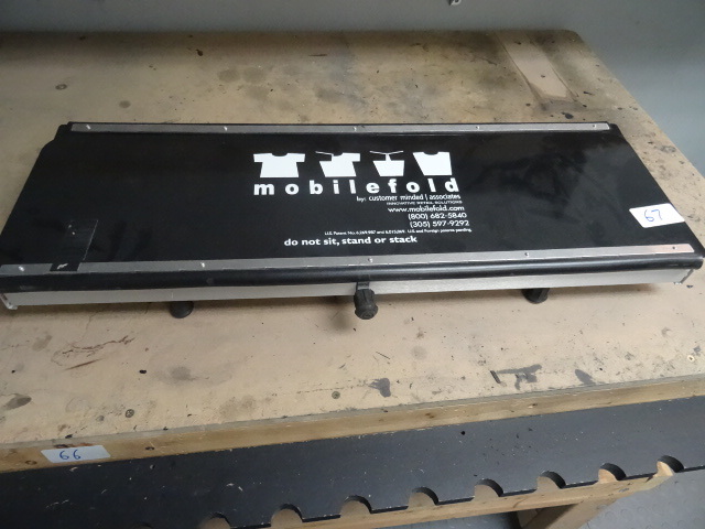 lot 67 image: Mobile fold shirt folder. For retail use