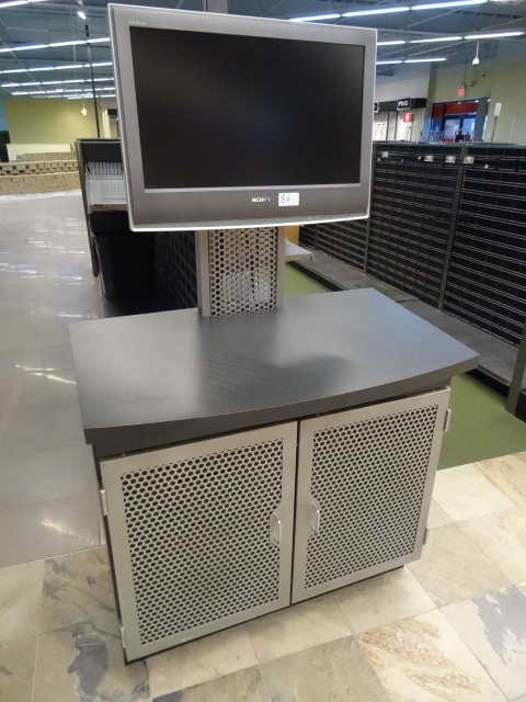 lot 86 image: Retail display with sony 26 monitor. 3 DVD players included. 2 doors. 39 x 22 x 64