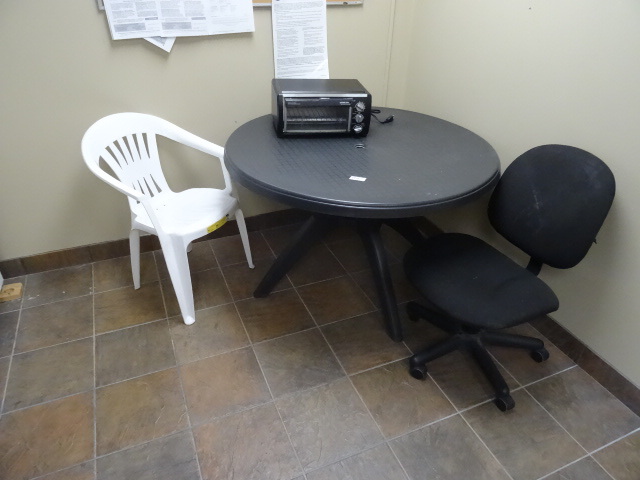 lot 88 image: 45 plastic patio table. 1 plastic patio chair. Black and Decker space maker toaster oven. 1 office chair on wheels.