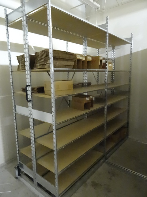 lot 103 image: Metal shelving unit. Wood shelves. 16 total length. 18 x 96. 28 shelves. No contents