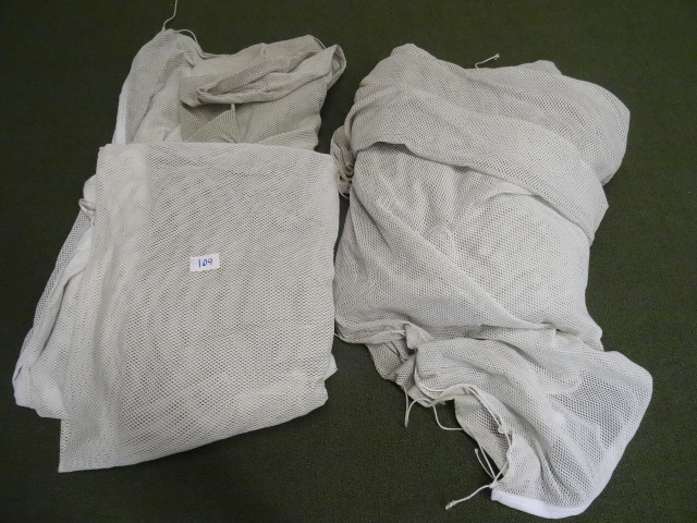 lot 109 image: 2 pieces of netting. Unknown size. Designed to be hung up.