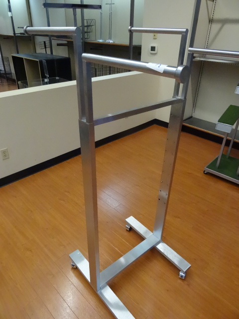 lot 39 image: 4 arm clothing rack on wheels. Adjustable height arms. 24 x 33. Qty 2