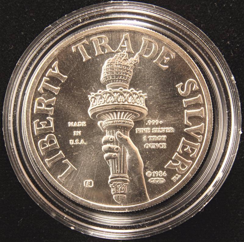 lot 27 image: 1 TROY OZ. .999 FINE SILVER LIBERTY TRADE SILVER IN AIRTITE HOLDER