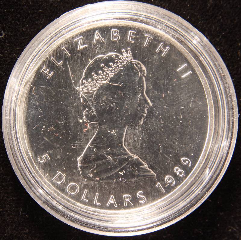 lot 32 image: 1989 CANADA MAPLE LEAF 1 TROY OZ. .9999 FINE SILVER IN AIRTITE HOLDER