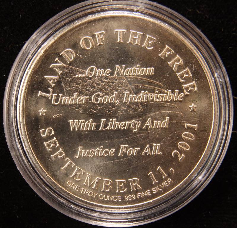lot 41 image: 1 TROY OZ. .999 FINE SILVER 9-11 SILVER ROUND IN AIRTITE HOLDER