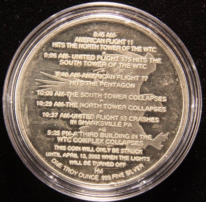 lot 52 image: 1 TROY OZ. .999 FINE SILVER 9-11 SILVER ROUND IN AIRTITE HOLDER