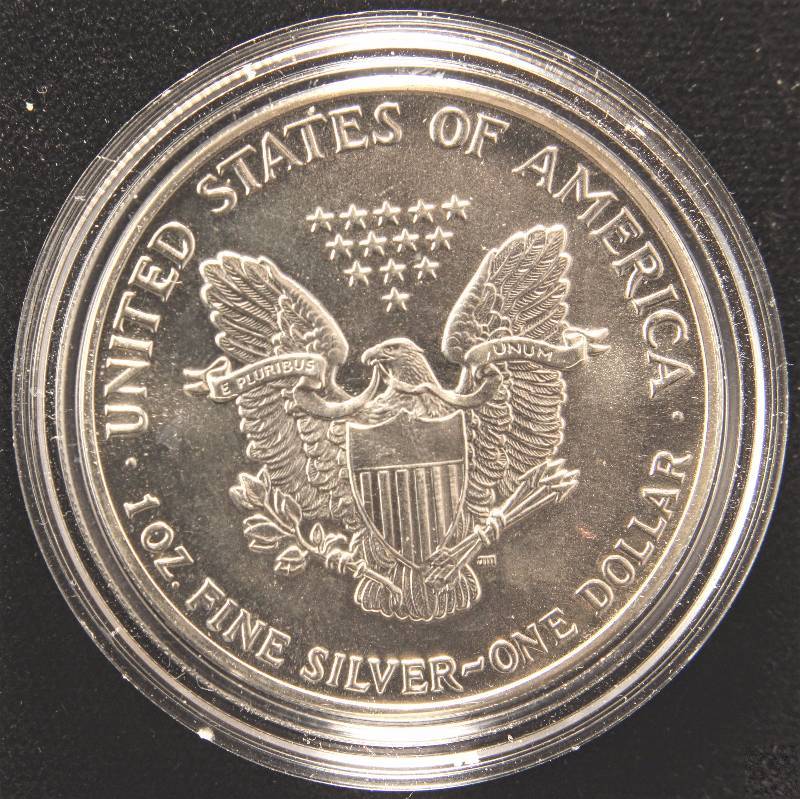 lot 53 image: 1987 AMERICAN SILVER EAGLE 1 TROY Oz. .999 FINE SILVER DOLLAR IN AIRTITE HOLDER