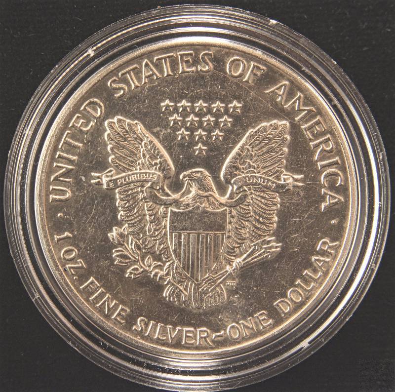 lot 84 image: 1988 AMERICAN SILVER EAGLE 1 TROY Oz. .999 FINE SILVER DOLLAR IN AIRTITE HOLDER