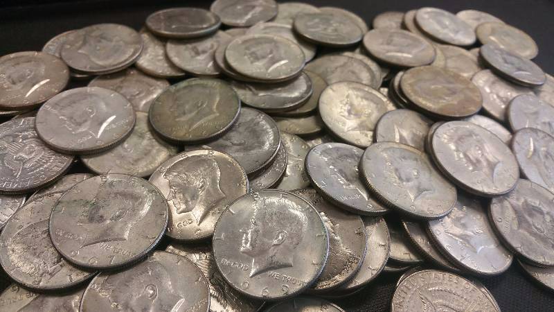 lot 99 image: GROUP OF 100 1965-1969 40% SILVER KENNEDY HALF DOLLARS IN AVERAGE GRADE