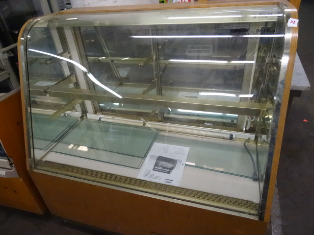 Glass front bakery candy case. Lighted. Royal brand. 2 rear sliding doors. Glass shelves. 48 x 24 x 50. Bring help to load. No help on site.