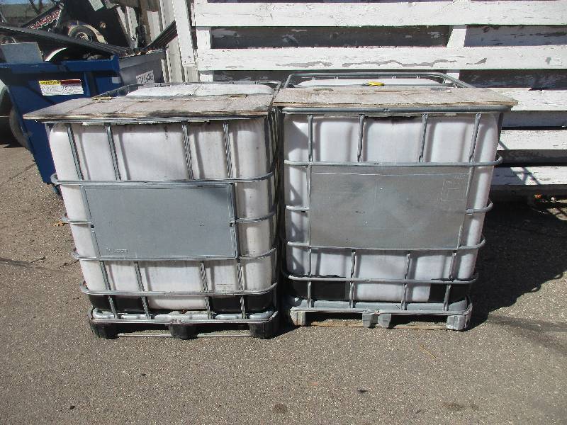 2- 275 gal plastic totes w door on top