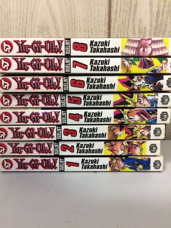 lot 25 image: YU-GI-OH PAPERBACKS VOLS 1-8