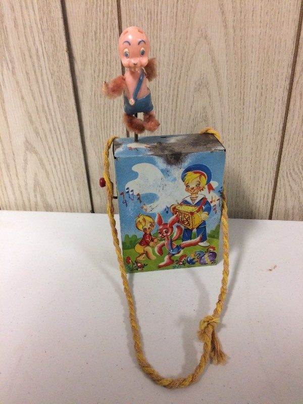 lot 58 image: VINTAGE TIN WINDING TOY