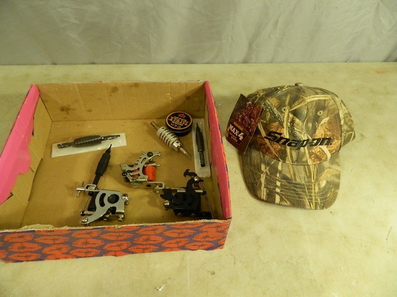 lot 18 image: New Snap On Hat and Tattoo Gun Supplies