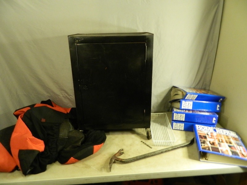 lot 99 image: Home Repair Manuals, Seat Covers, Metal Shop Cabinet, Etc