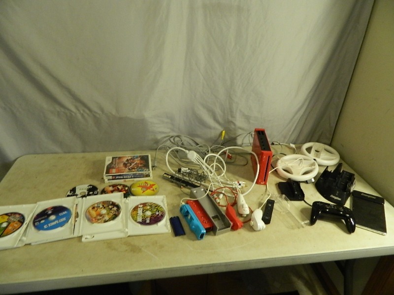 lot 107 image: Nintendo Wii System with Games