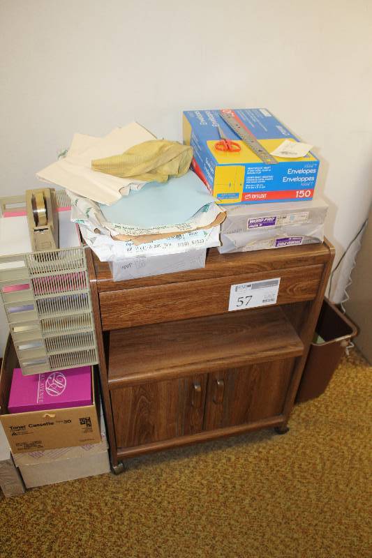 lot 57 image: 2-Door 1-Drawer Wood Rolling Cabinet w Contents