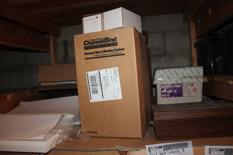 lot 198 image: Shelf Lot of Copier Paper, Binders, Luggage