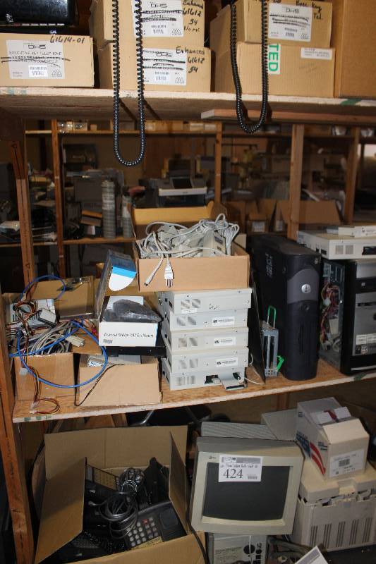 lot 424 image: Shelf Lot of Phone System Parts
