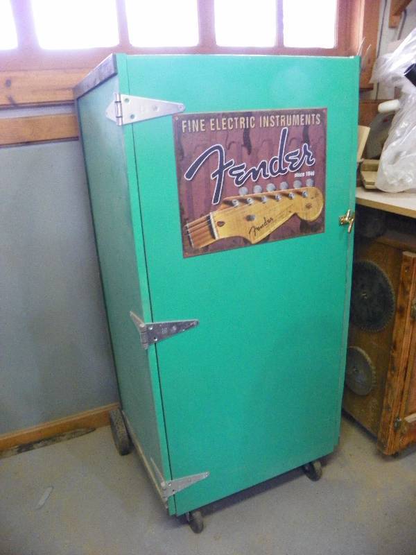 lot 9 image: Storage cabinet with the stereo and speakers inside