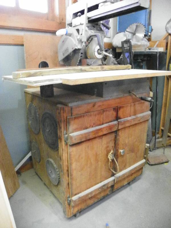 lot 13 image: Delta Rockwell Radial Arm Saw, with cabinet and its contents