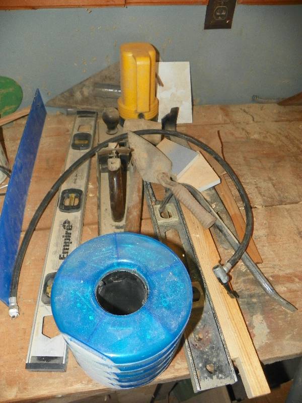 lot 57 image: small organizer, levels, hand planer, trowel, pry bar