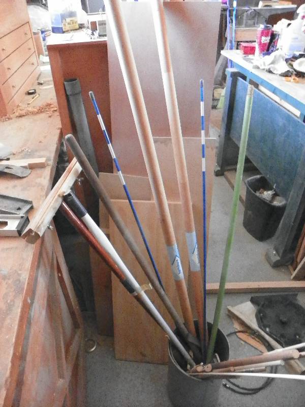 lot 59 image: Handles, sticks, boards and bucket