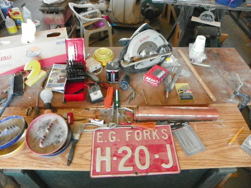 lot 86 image: Circular saw, license plate, ashtrays, drill bits, small hand tools and other misc items