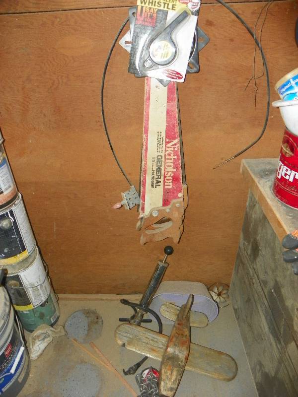 lot 92 image: Small wooden plane, hand saws, chain and other misc items