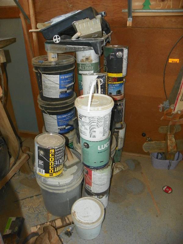 lot 93 image: Stack of paint and painting supplies