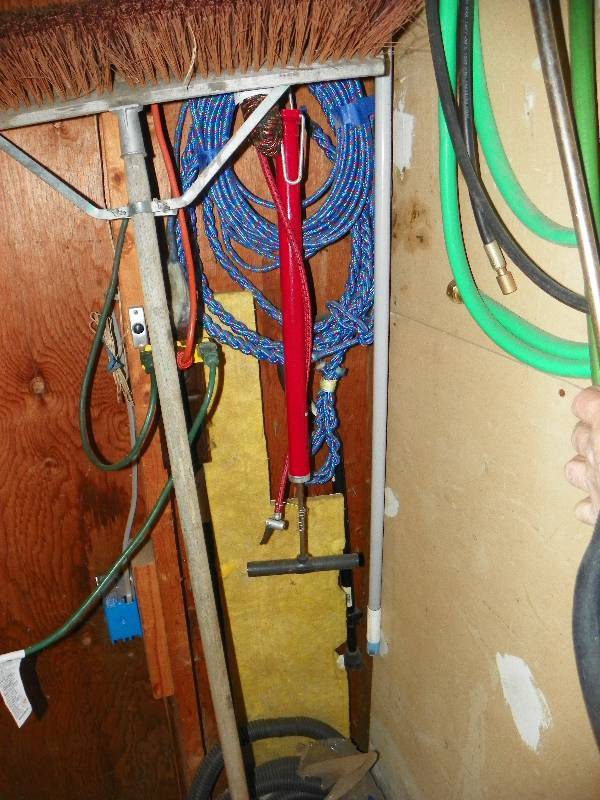 lot 107 image: Push broom, tire pump, sump hose and rope