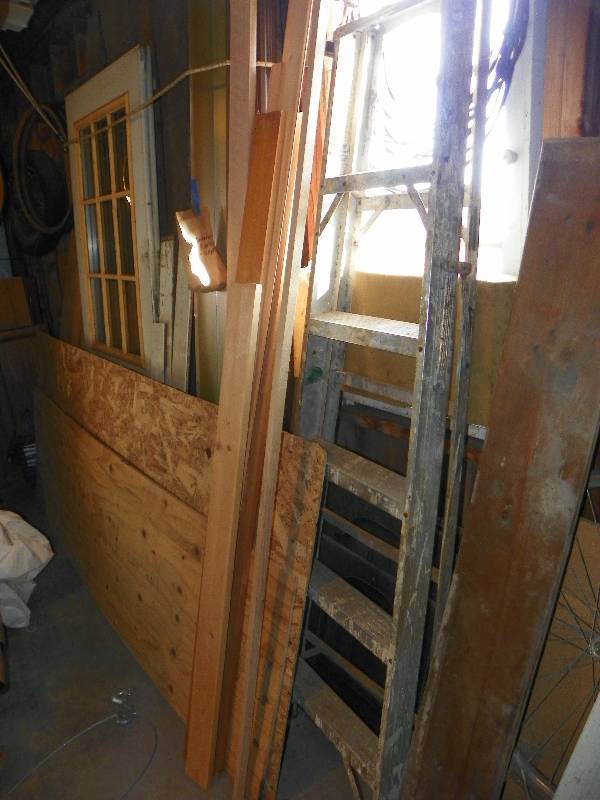 lot 116 image: Ladder, plywood, older door, and boards