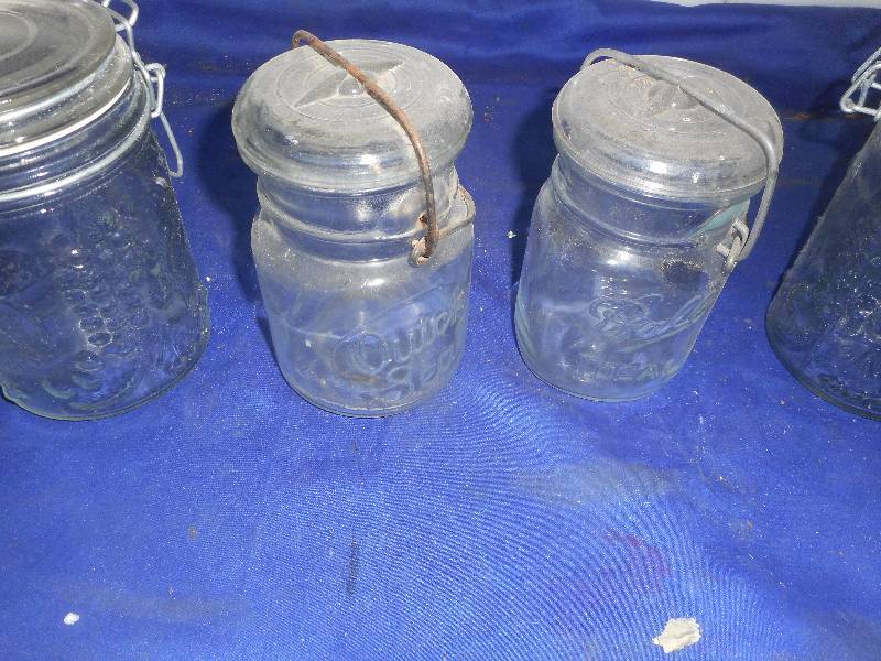 4 collectible jars glass tops