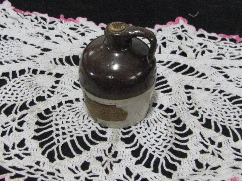 lot 4 image: Red Wing 12 pt Crock Whiskey Jug from Rhinelander Hotel, Rhinelander, Wisc.