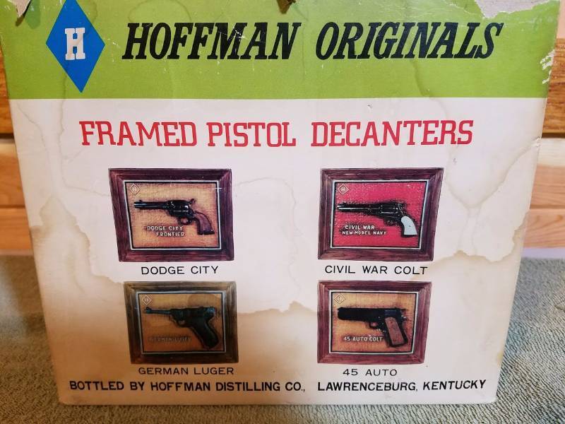 lot 5 image: Ceramic Wall Piece,Pistol Decanter