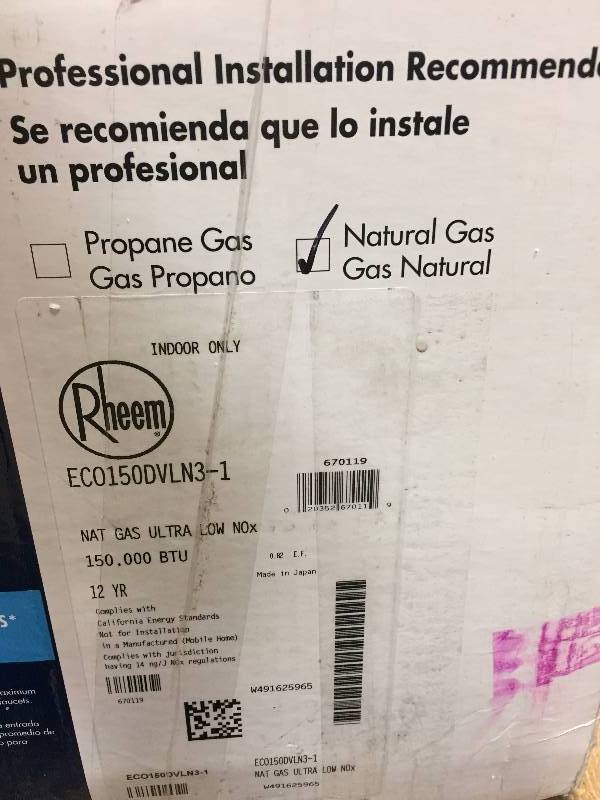 lot 109 image: Rheem 6.4 GPM Natural Gas Mid Efficiency Indoor Tankless Gas Water Heater - units look like in a new condition but it also has signs that it was used or installed