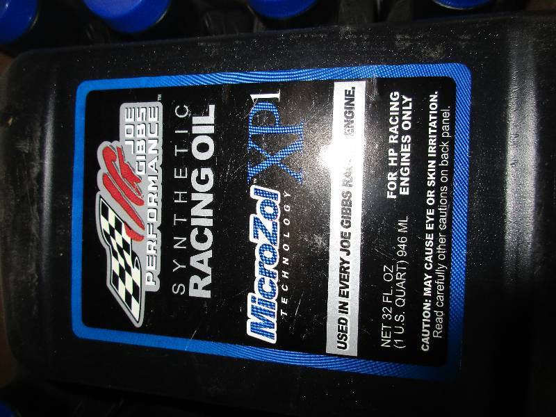 lot 9 image: 9 quarts synthetic racing oil - Joe Gibbs performance