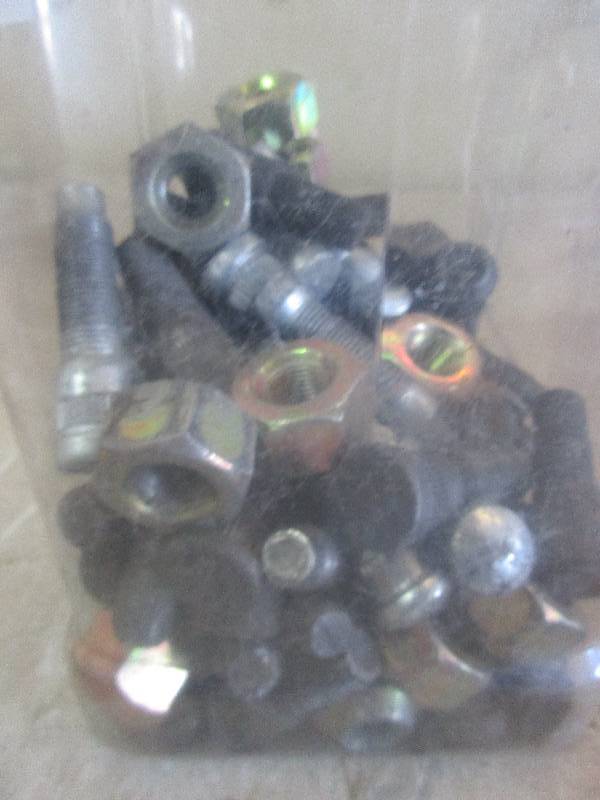 lot 124 image: jug of lug nuts and studs