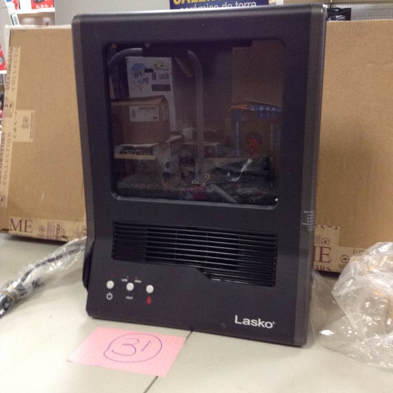 Lasko Ceramic Heater Ultra-Fireplace- Never used damage on bottom corner