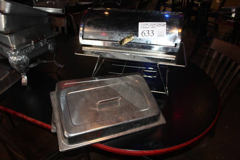 lot 633 image: Lot of (9) Commercial Stainless Steel Kitchenware Includes 1) Full Size Roll-Top Chafer Stand, 2) Lids, 1) Roll-Top, 1) Steam Tray, 4) 8-Quart Pans