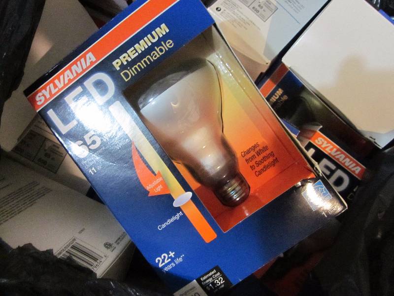 lot 21 image: Large Garbage Bag of Flood Bulbs, Christmas Tree Stand, & Cleaning Brushes