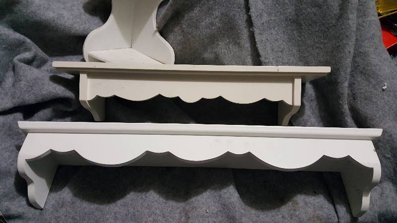 Three white wood shelves