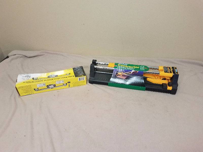 lot 178 image: NIB Tile cutter and Fan brace