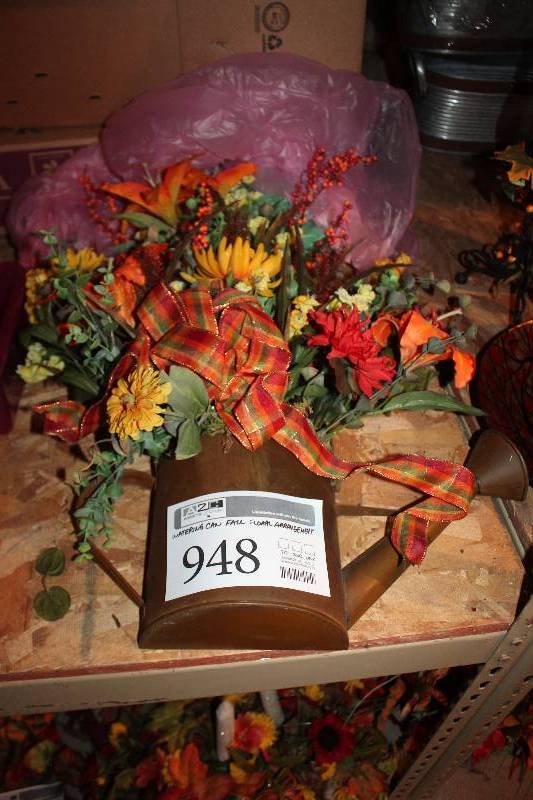lot 948 image: Watering Can Fall Floral Arrangment