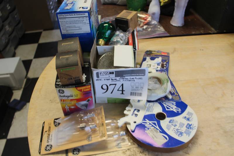 lot 974 image: Misc Light Bulbs, Mini Extension Cord Holders, Floral Adhesive