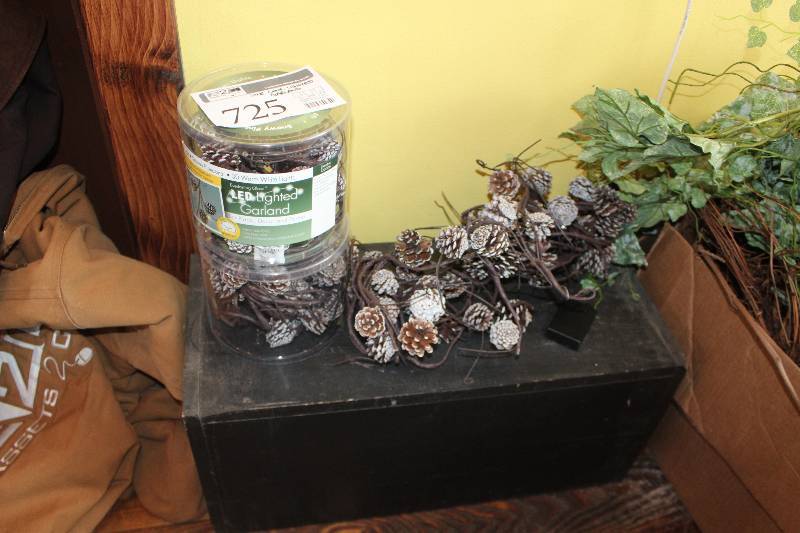 lot 725 image: Pine Cone Lighted Garland, Black Display shelf Included