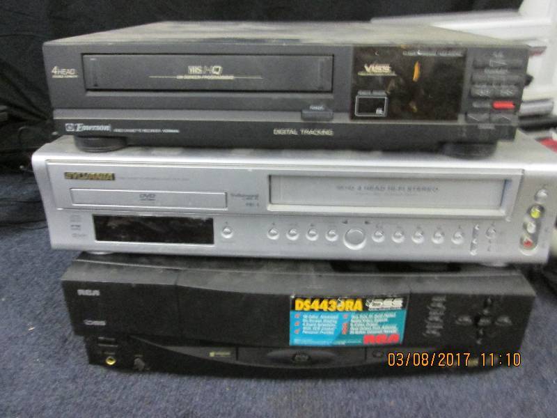 lot 24 image: 2 dvd players and 1 vhs and 1 rca s...