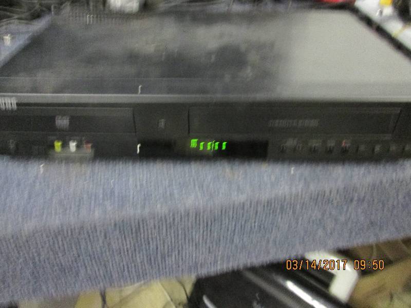 lot 89 image: samsung dvd and vhs player powers o...