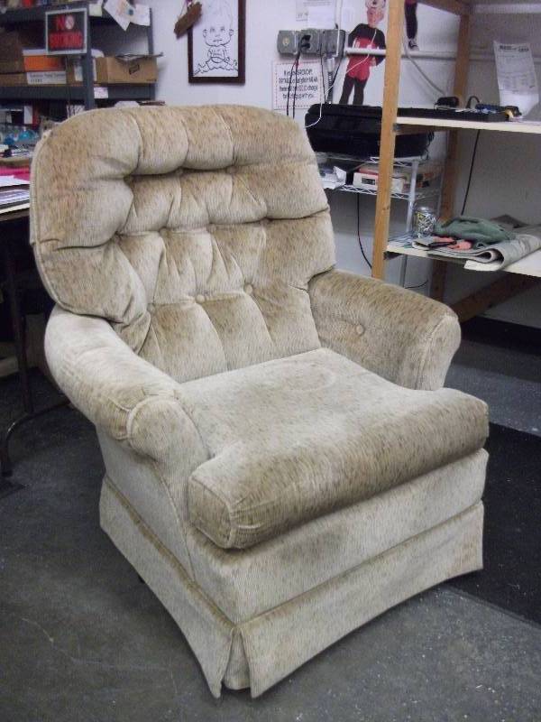 lot 15 image: Beige Swivel Rocking Chair